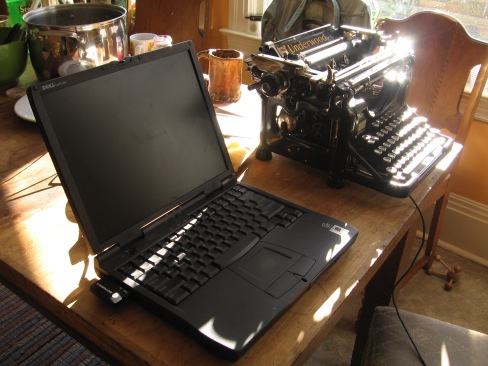 A_laptop_and_a_typewriter